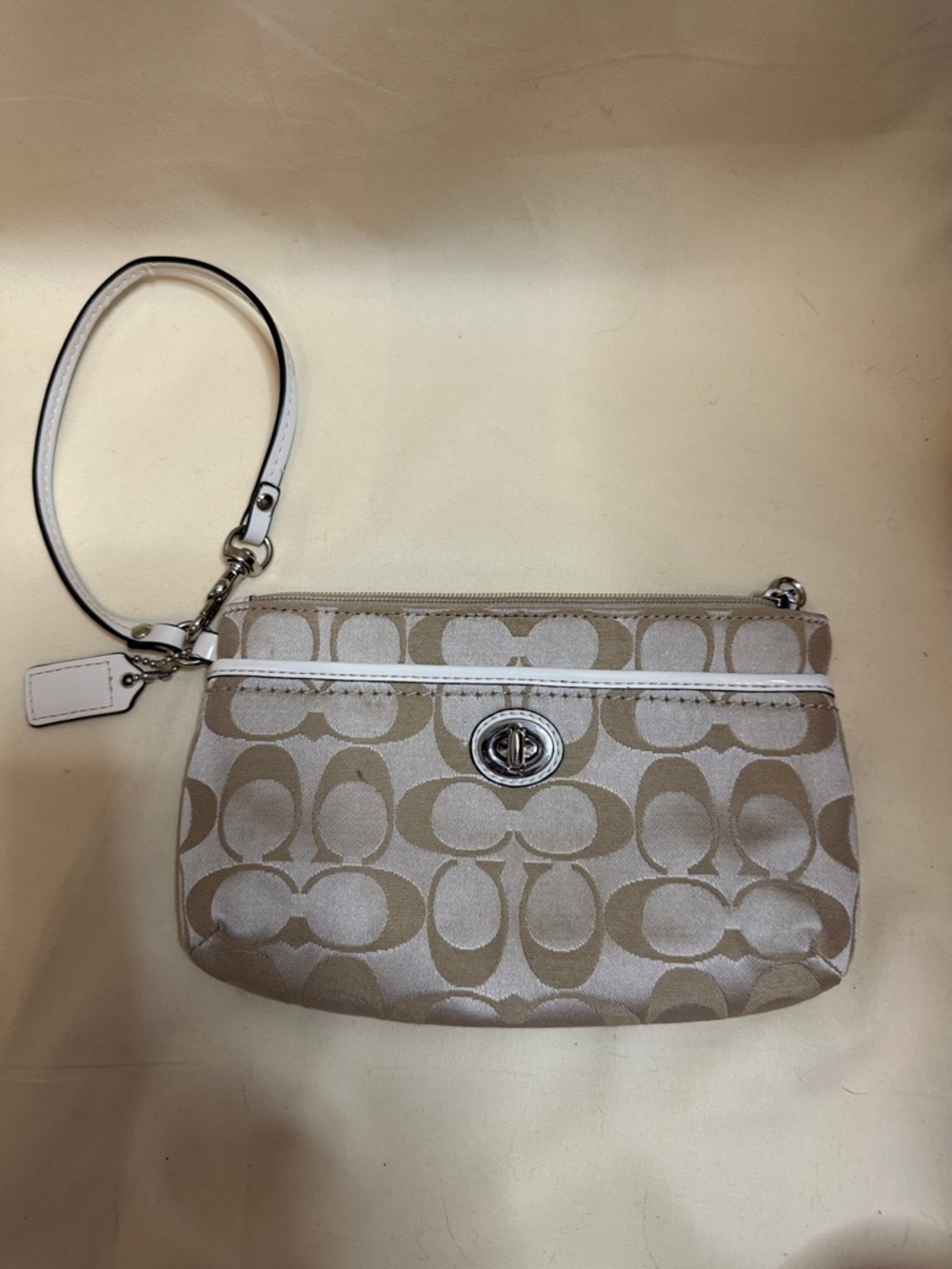 Coach Beige and White Signature Canvas Wristlet with Turnlock